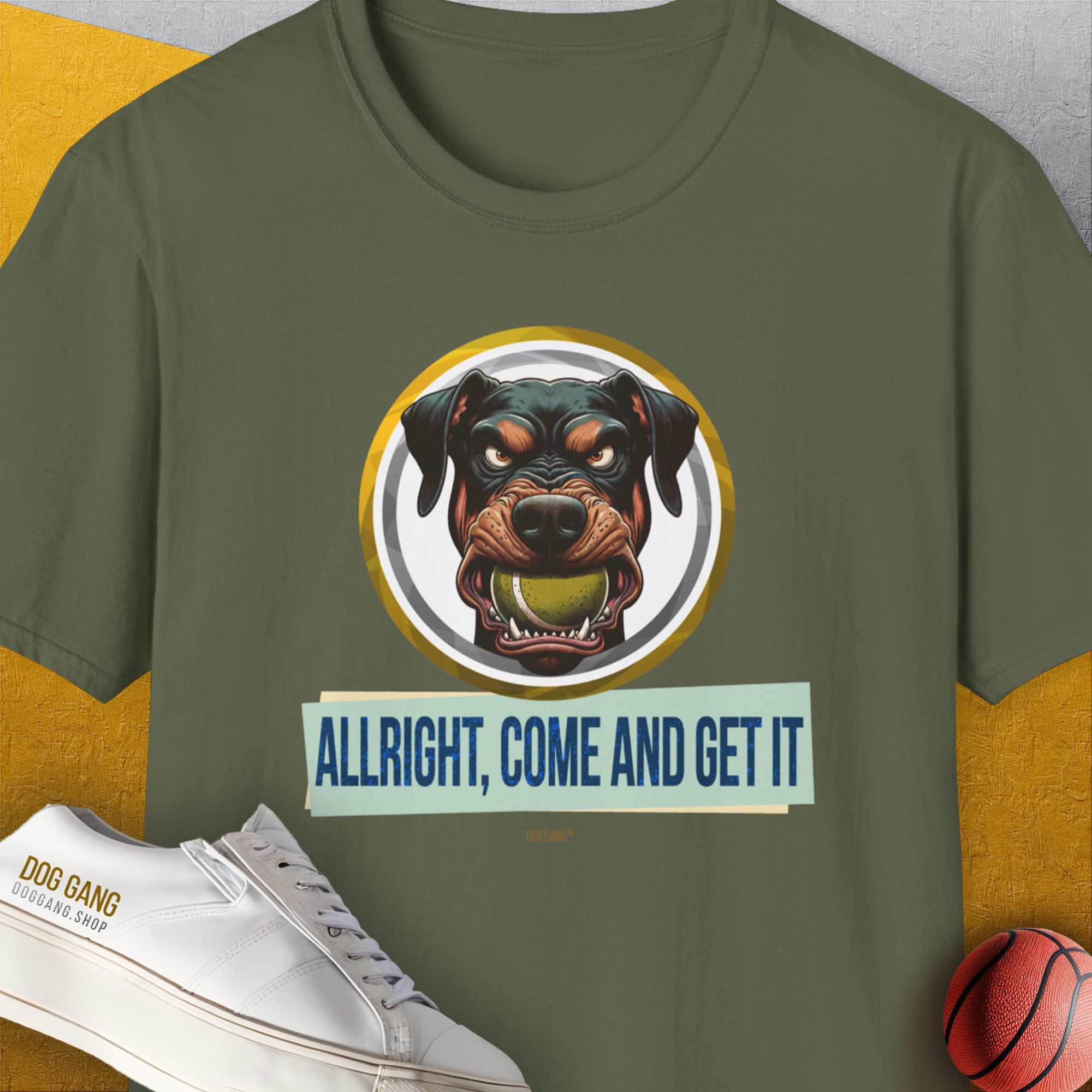 The Allright Come And Get It, Volume 2 T-shirt showcases a dogs face with the phrase ALLRIGHT, COME AND GET IT alongside a small basketball. Funny dog shirt for every enthusiast. Designed by Dog Gang.