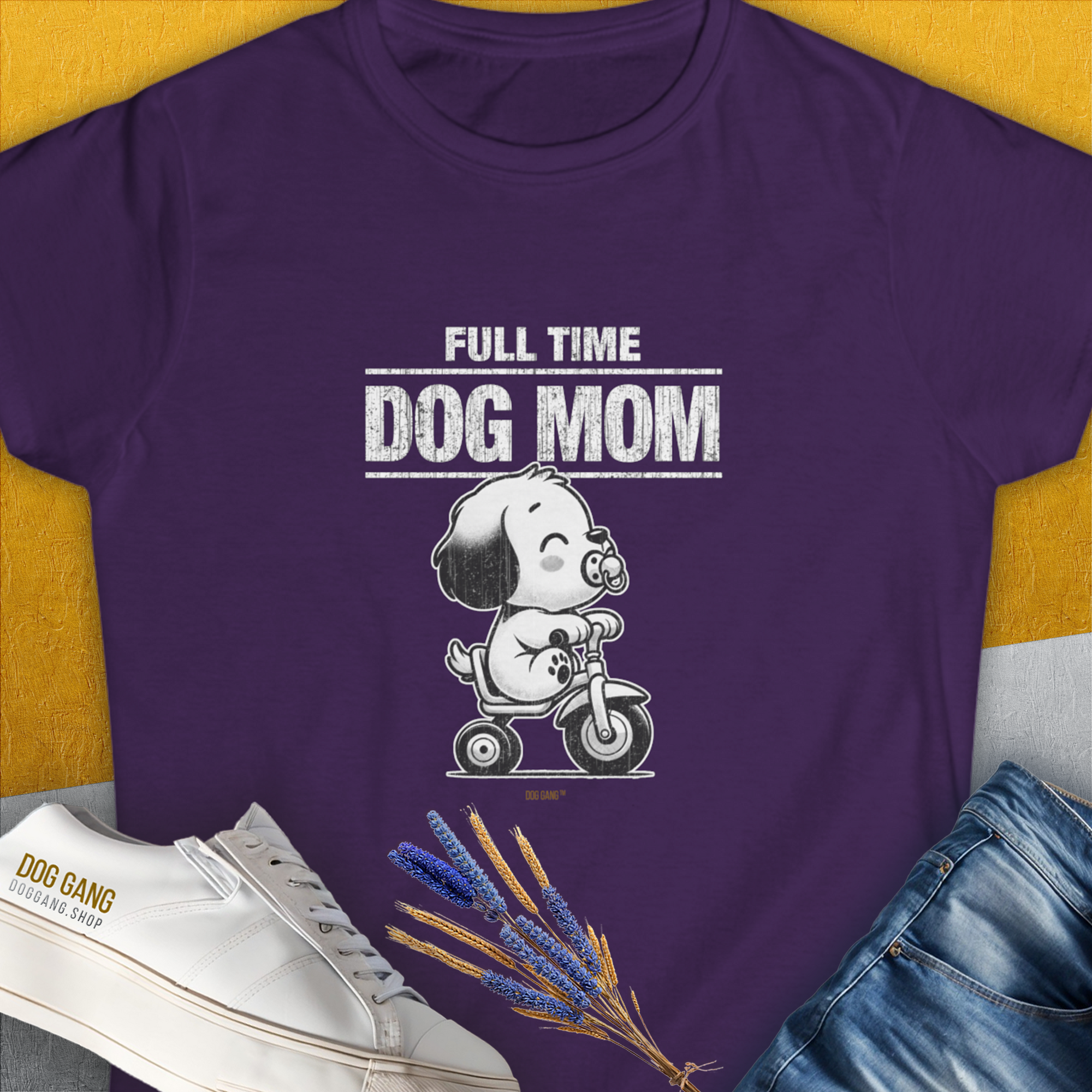 The shirt showcases the quote "Full Time Dog Mom" alongside a cartoon dog on a scooter. Its a perfect funny dog shirt for any dog owner or lover. Designed by Dog Gang.