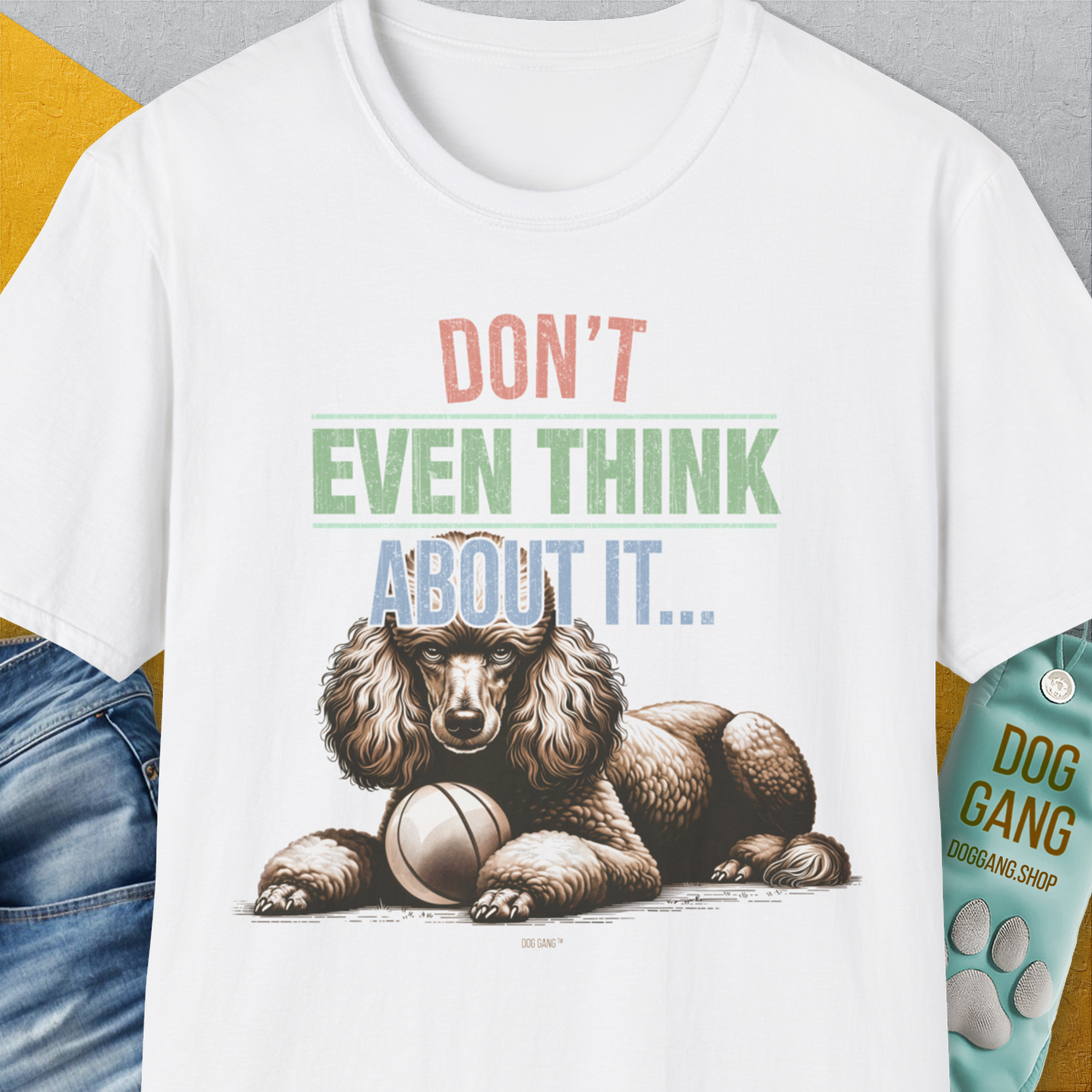 Dont Even Think About It..., Volume 1 features a playful poodle illustration guarding a fetch ball with bold text. Perfect for any dog person. From the Swiss design label Dog Gang.