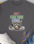 Funny dog shirt with a playful design of a dog guarding his fetch ball that reads "Dont Even Think About It...", Volume 3 from the series, on charcoal fabric. Designed by Dog Gang.
