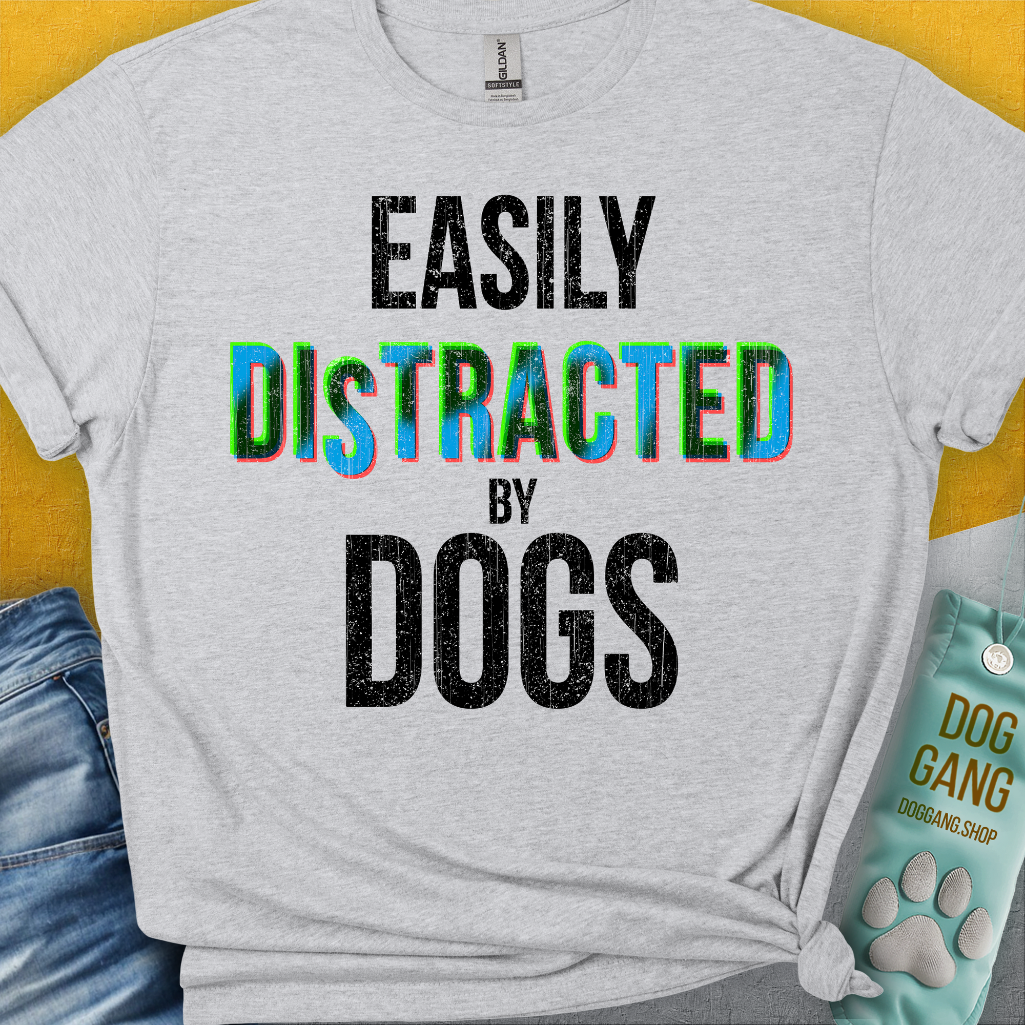 Cute dog design featuring a playful pup with the saying, Easily Distracted by Dogs. Perfect for any dog lover. Designed by Dog Gang.
