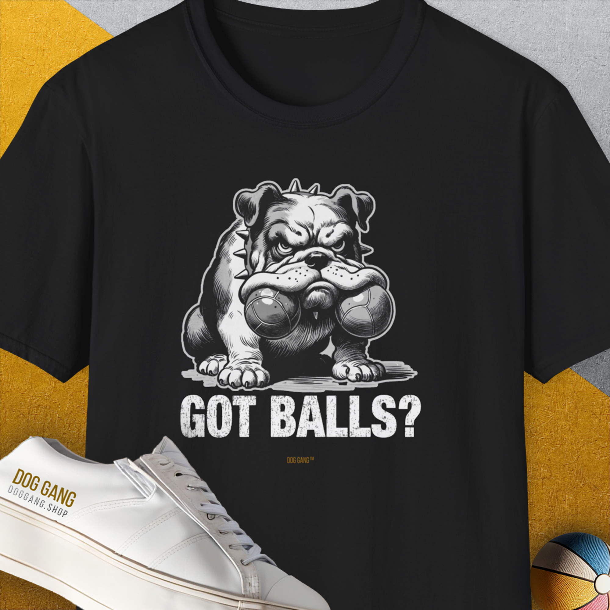 Black unisex Got Balls? Volume 3 t-shirt features a cute dog design with a cartoon bulldog holding two fetch balls in his mouth and the cheeky caption "Got Balls?" Designed by Dog Gang.