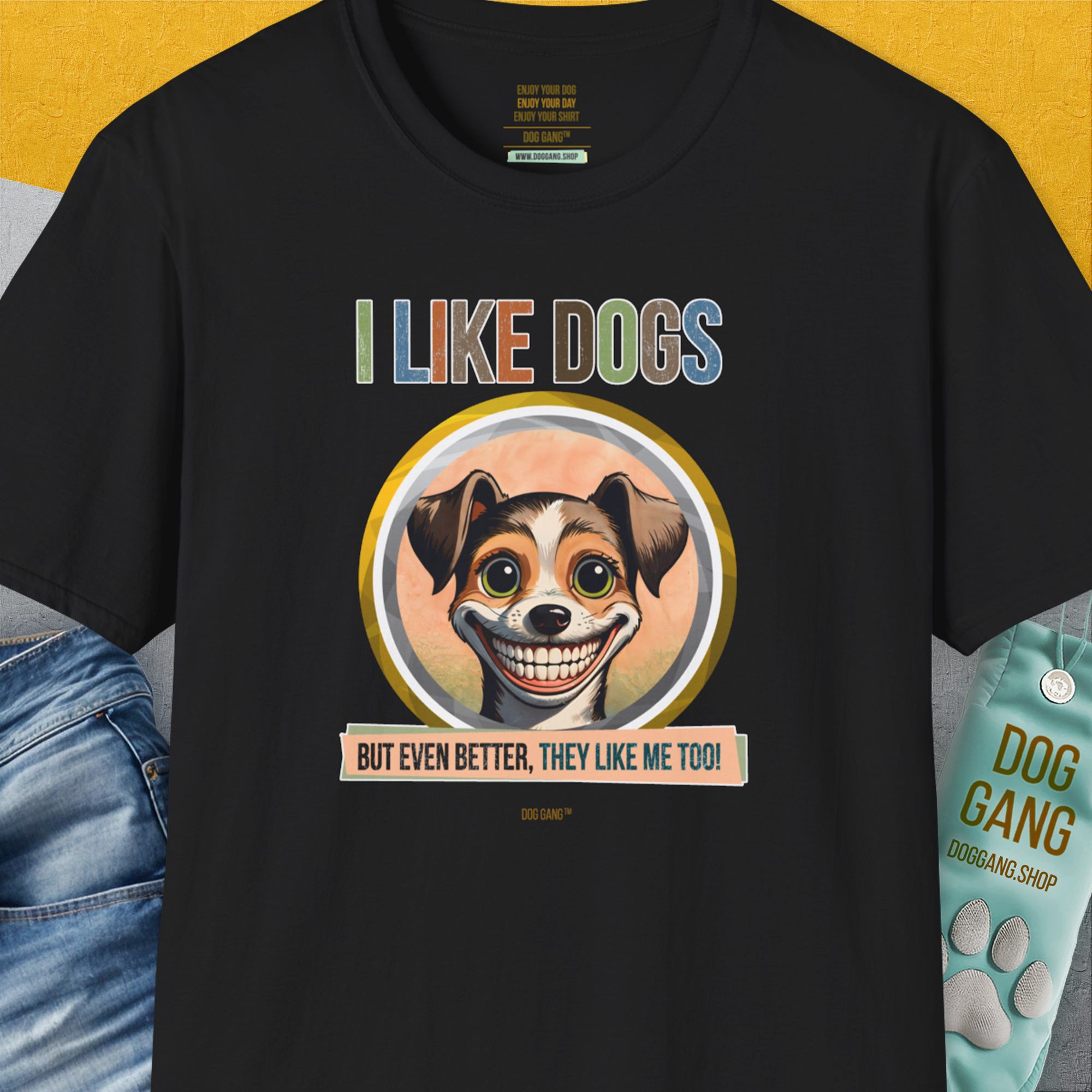 The I Like Dogs And They Like Me Too, Volume 2 unisex T-shirt showcases a cartoon dog face with playful text. Ideal for any dog person. Designed by Dog Gang.