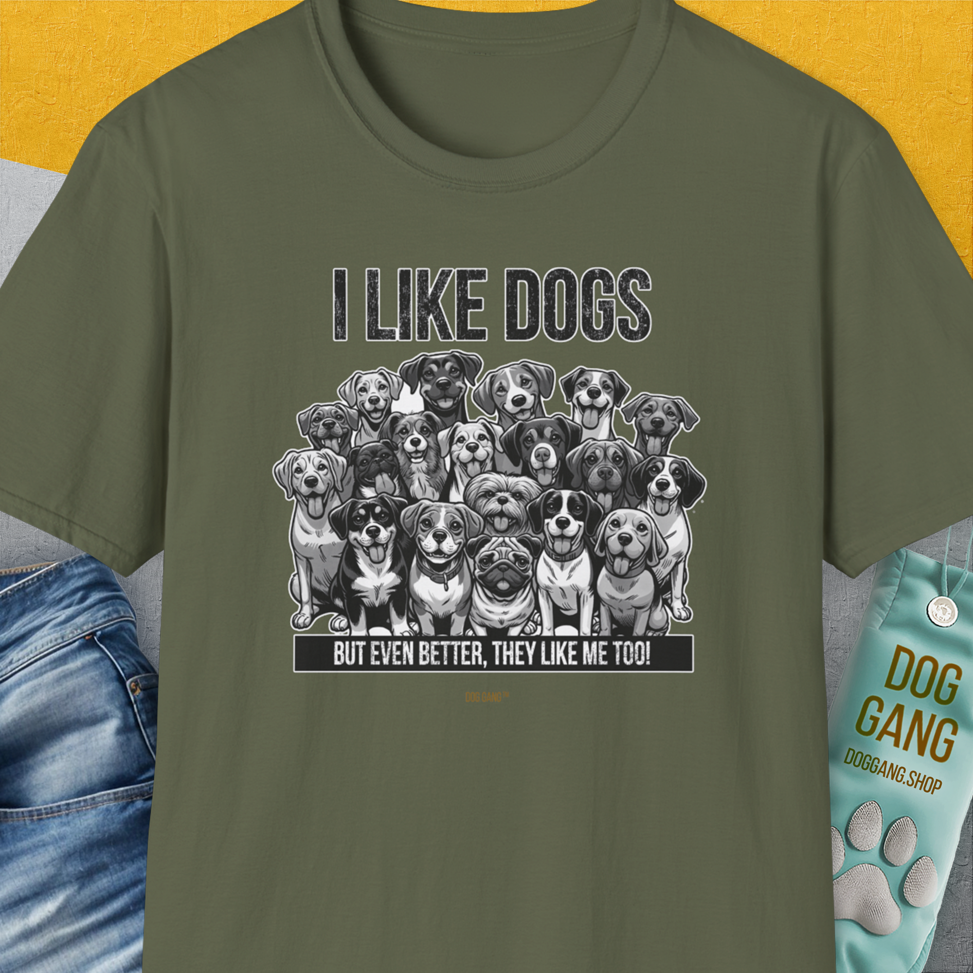 Designed by Dog Gang, this military green unisex T-shirt features charming dog illustrations with the quote, I Like Dogs But Even Better, They Like Me Too! Perfect for any dog lover.