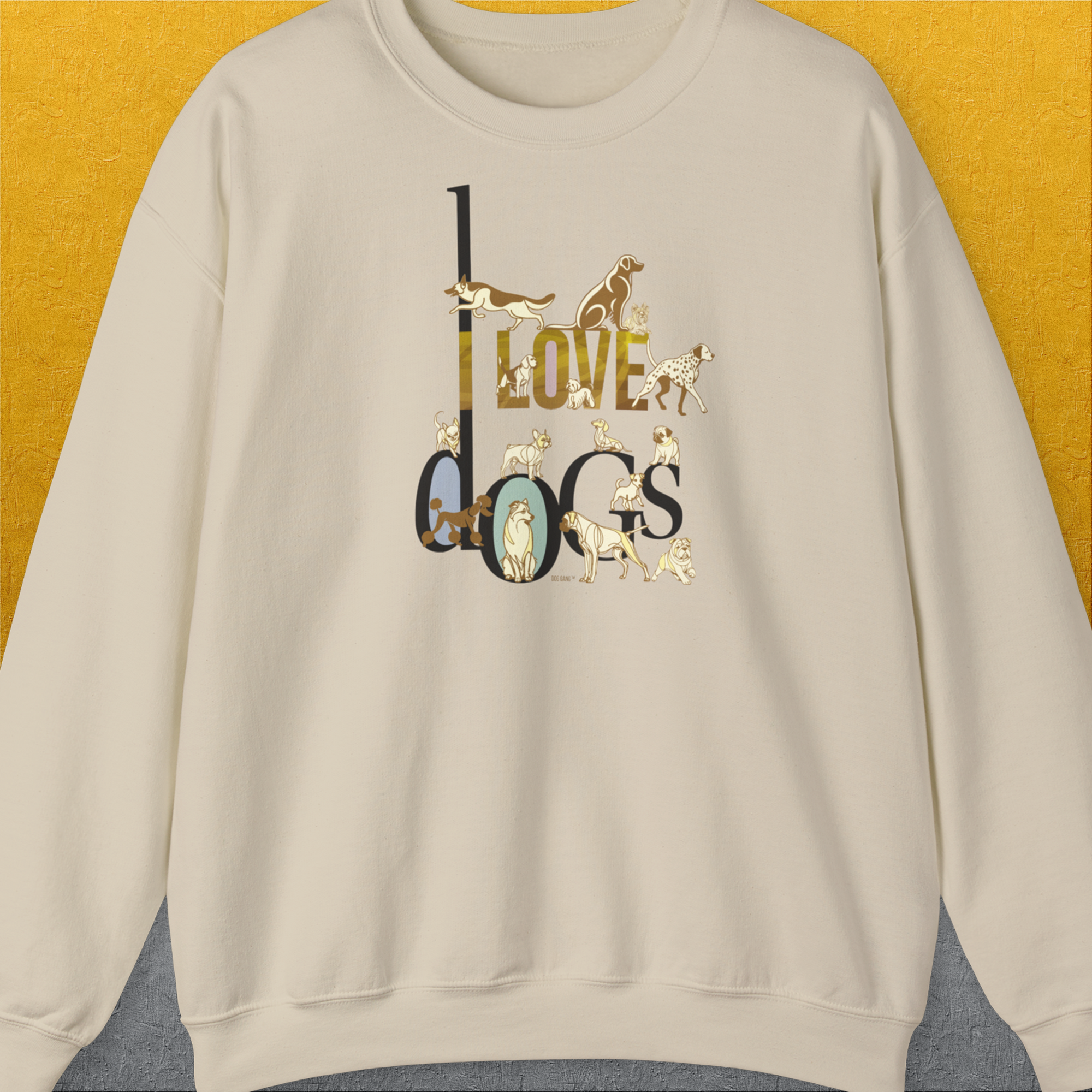 The unisex sweatshirt features I Love Dogs text with illustrated dogs in a cute design. Perfect for any dog lover gift. Designed by Dog Gang.