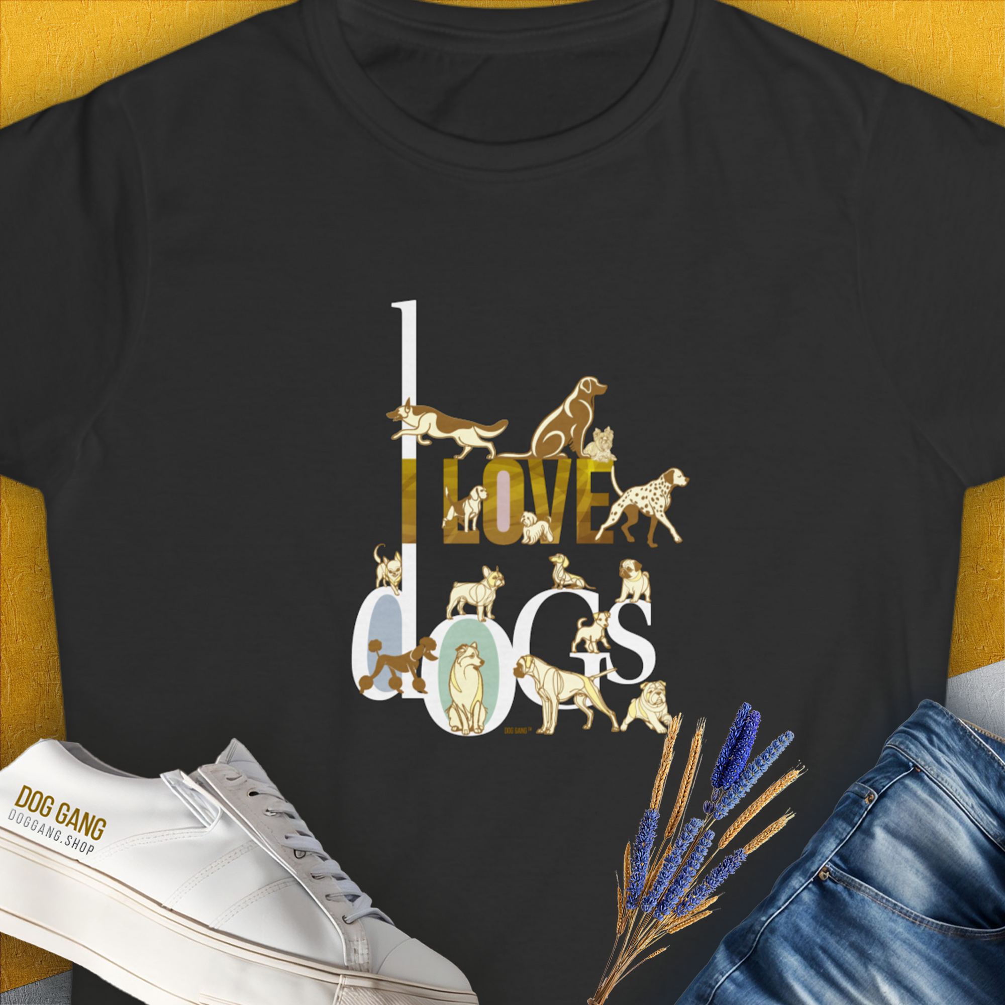 The black I Love Dogs - Series I, Volume 1 Womens T-Shirt showcases the text I LOVE DOGS in an ornate gold / brown-colored style, featuring illustrations of various dog breeds: a Dalmatian, a Golden Retriever, a Pug, a Poodle, Dachshund, French Bulldog, English Bulldog, Chihuahua, Husky and more. Designed in Switzerland by Dog Gang.