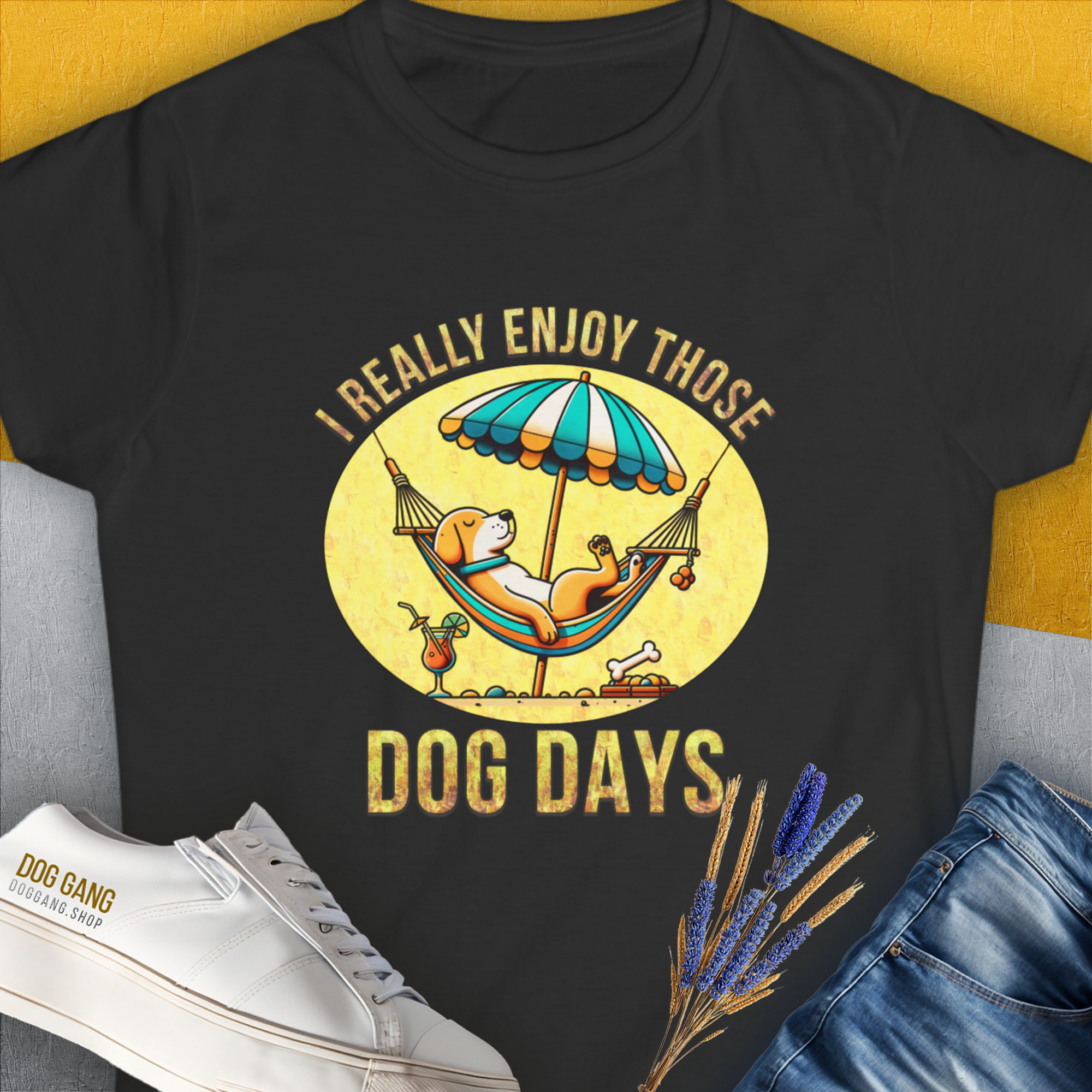 This puppy print tee features a cartoon dog chilling under an umbrella with the phrase I really enjoy those dog days. Perfect for any dog person. Designed by Dog Gang.