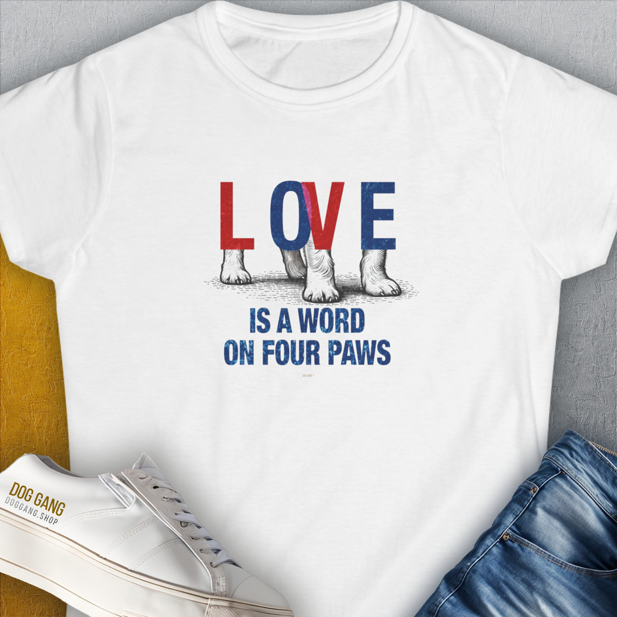 Designed by Dog Gang. The Love Is A Word On Four Paws, Volume 1, Womens T-Shirt features a cute dog design with Love is a word on four paws text accompanied by paw illustrations.