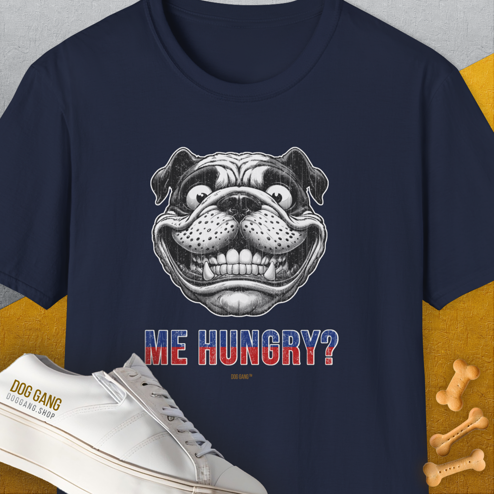 The Me Hungry? Volume 5 unisex T-shirt features a funny bulldog face with the caption ME HUNGRY? and playful dog bones. Cute dog design on navy cotton. Designed by Dog Gang.