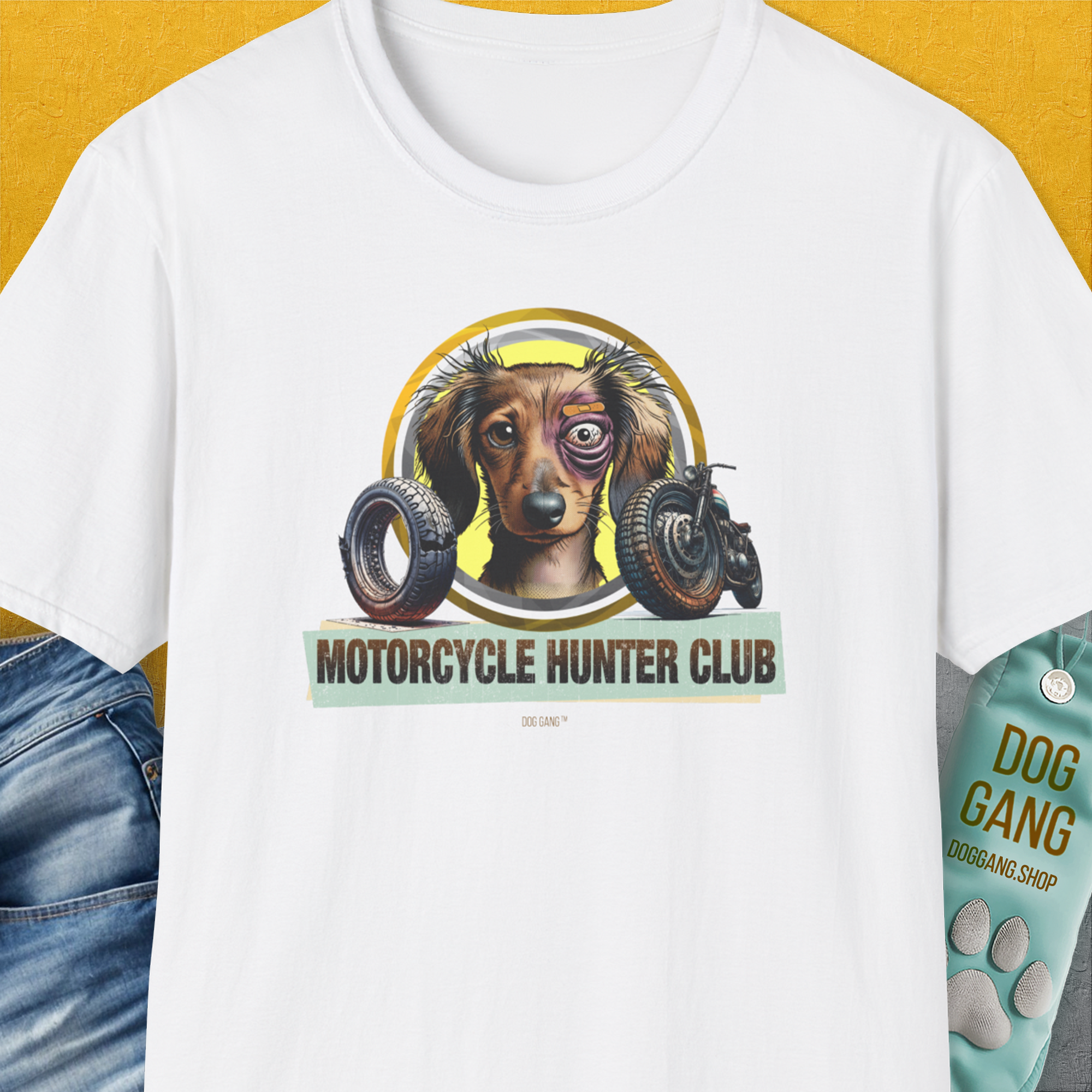 White unisex T-shirt, Motorcycle Hunter Club, Volume 5 (Dackel / Dachshund), with a slightly battered Dachshund and motorcycle motifs. Perfect for any funny dog shirt enthusiast. Designed by Dog Gang.