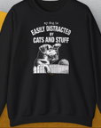 My Dog Is Easily Distracted By - Volume 2: Cats And Stuff features a cute dog design with a dog peeking over a fence. Designed by Dog Gang.