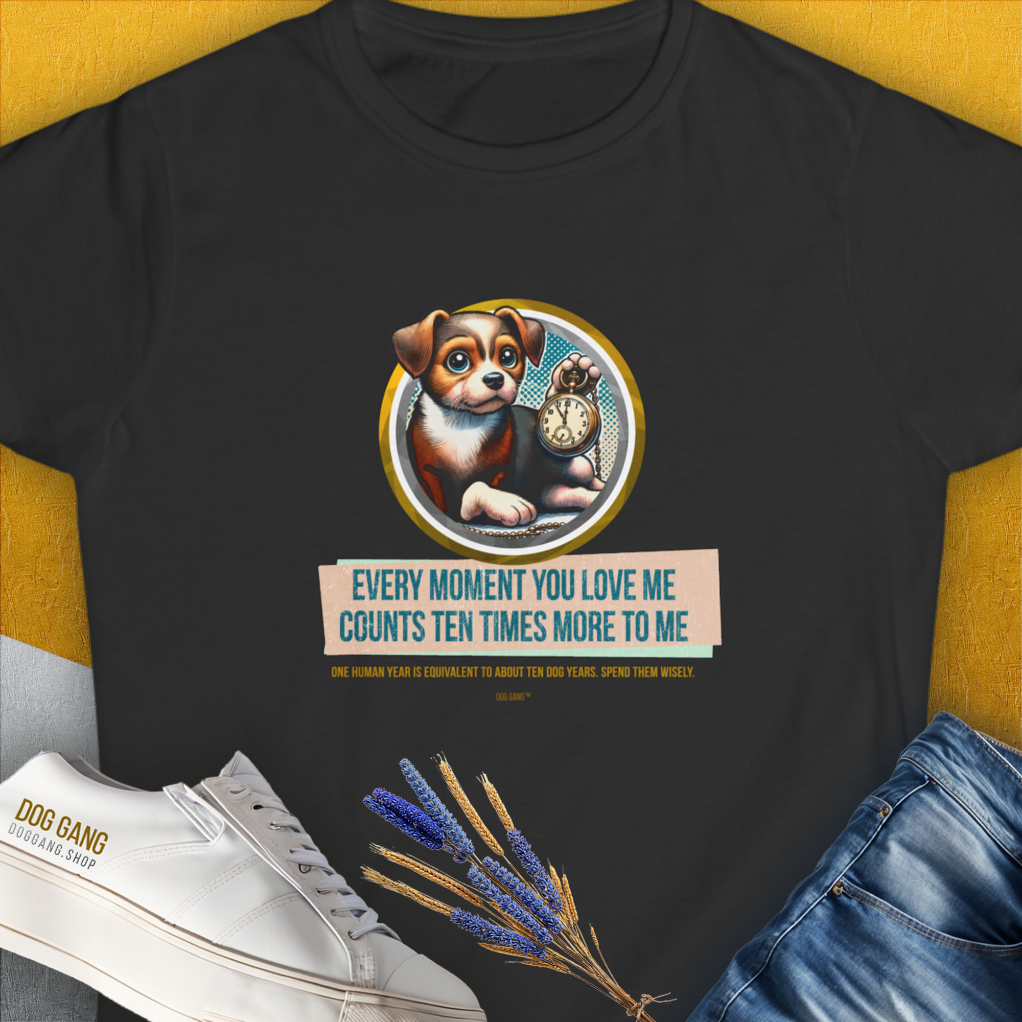 The womens t-shirt in black showcases a cute dog design with a pocket watch and the saying, Every moment you love me counts ten times more to me. Designed by Dog Gang.