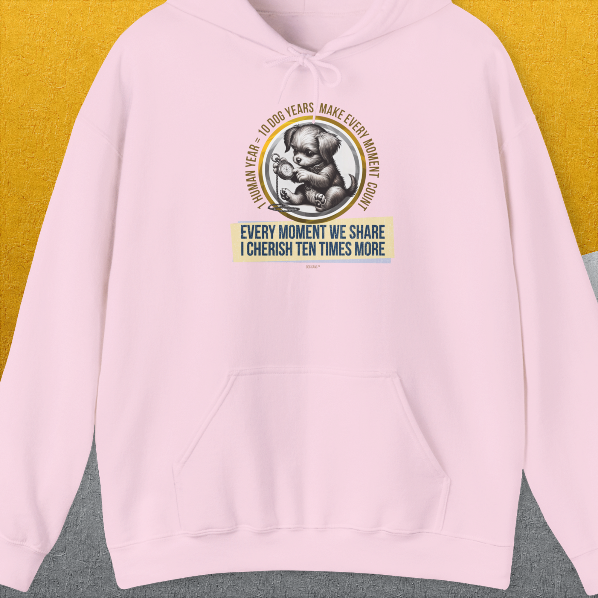 The hoodie showcases a funny dog shirt design with the saying One Human Year = Ten Dog Years, Volume 4 featuring a vintage circular koala graphic. Designed by Dog Gang.