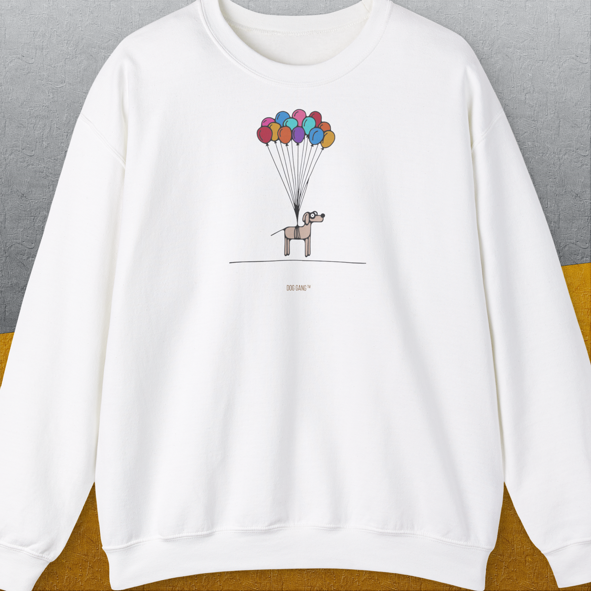 Funny dog shirt featuring a cartoon dog with colorful balloons floating above. Designed by Dog Gang.