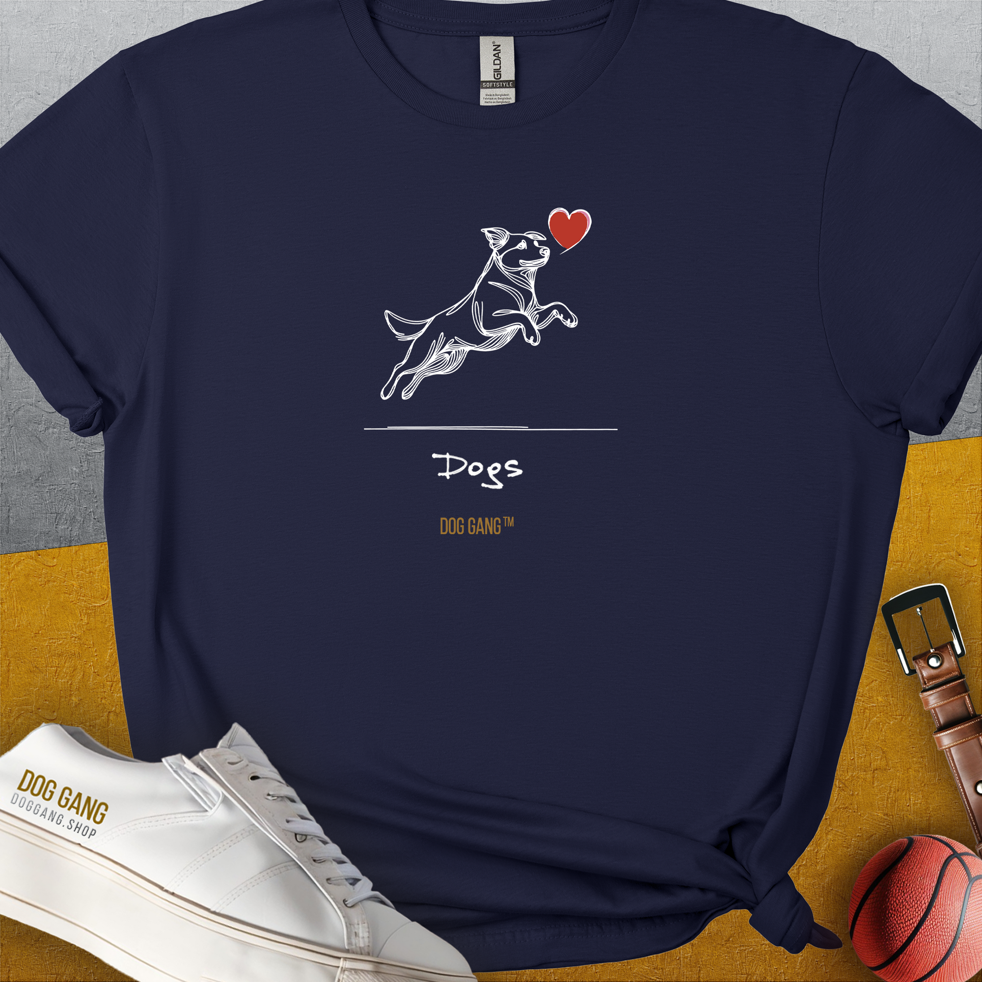 The Dog Gang Minimalistic Series I, Volume 3 Unisex T-Shirt showcases a cute dog design with a simple dog graphic and the word Dogs printed on navy blue cotton. Designed by Dog Gang.