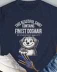 The womens tee, This Beautiful Shirt Contains Finest Dog Hair Of Exclusive Quality (Volume 1 from the popular series of the same name), showcases a playful cartoon dog holding fur, set against the navy blue backdrop of softstyle fabric. Shirtdesign by Dog Gang creates a delightful combination of comfort and style in this unique piece.