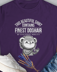 The design features the witty quote This Beautiful Shirt Contains Finest Dog Hair Of Exclusive Quality, Volume 2, accompanied by a playful dog graphic. Designed by Dog Gang.