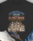 The black womens T-shirt features playful dog illustrations and the humorous saying, "This Beautiful Shirt Contains Finest Dog Hair." Volume 6 from the popular series of the same name. Perfect for every dog lover. Designed by Dog Gang.