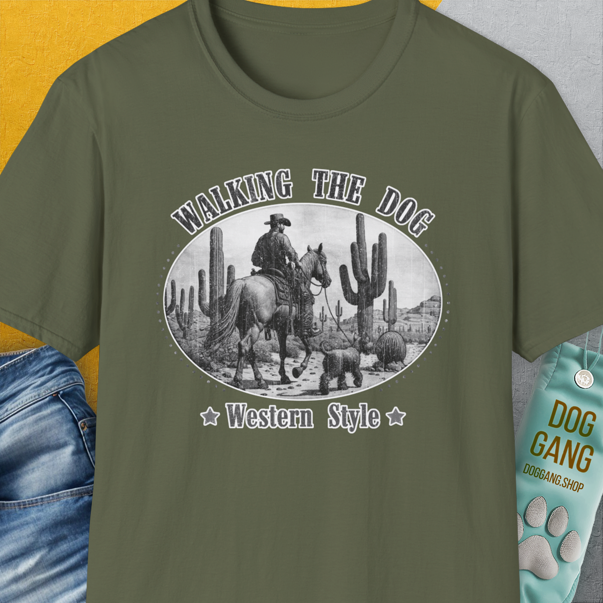 Walking The Dog, Western Style, Volume 1 t-shirt features a cowboy and dog design with a vintage touch. Perfect for any dog person who loves the wild west. Designed by Dog Gang.