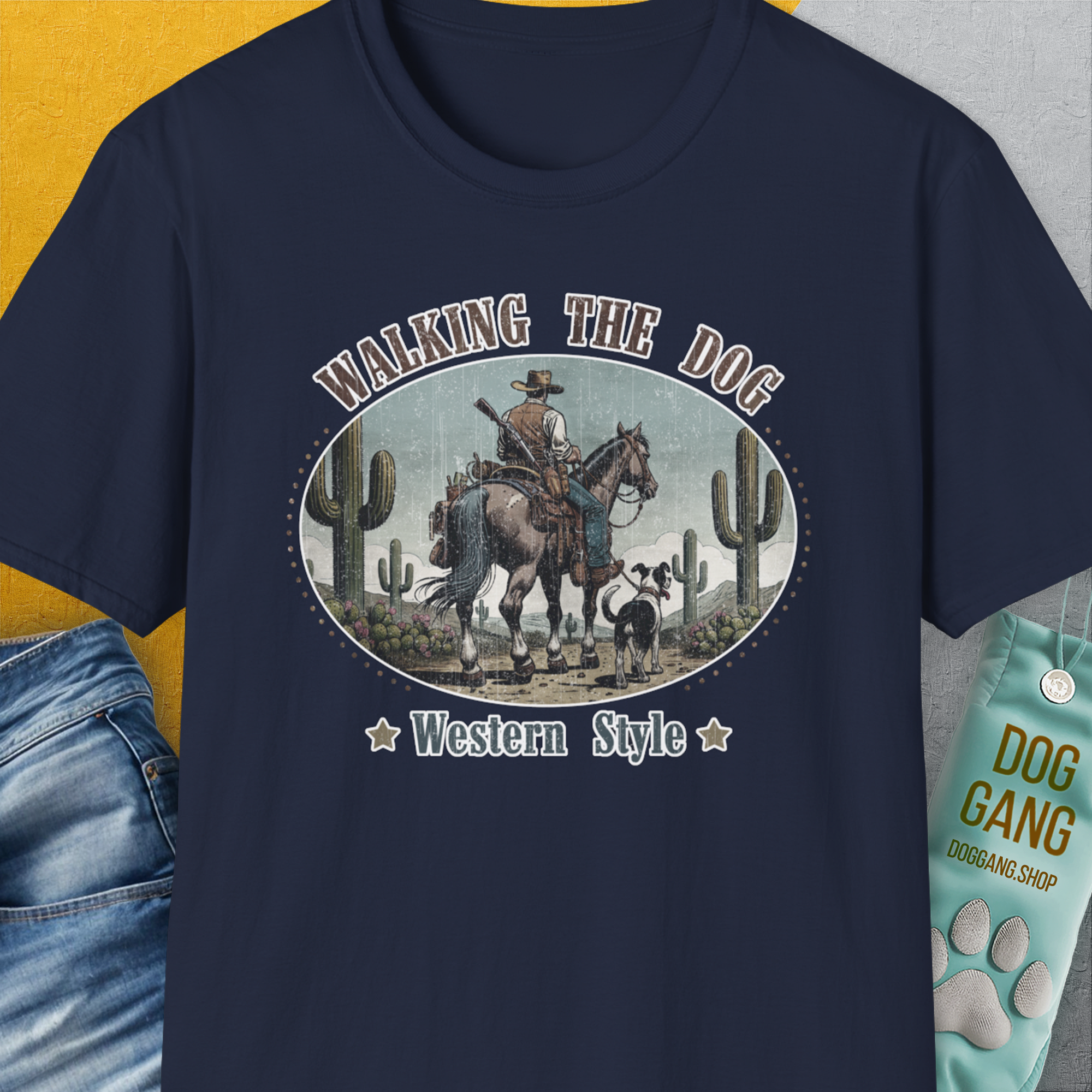 Our Walking The Dog, Western Style, Volume 2 unisex T-shirt in navy features a cowboy and dog design with cacti. Perfect for any dog lover gift. Designed by Dog Gang.