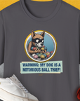 Charcoal soft-style 100% cotton unisex T-shirt featuring a masked dog illustration and Warning: My Dog Is A Notorious Ball Thief! text. Perfect for any dog owner with a sense of humor. Designed by Dog Gang.