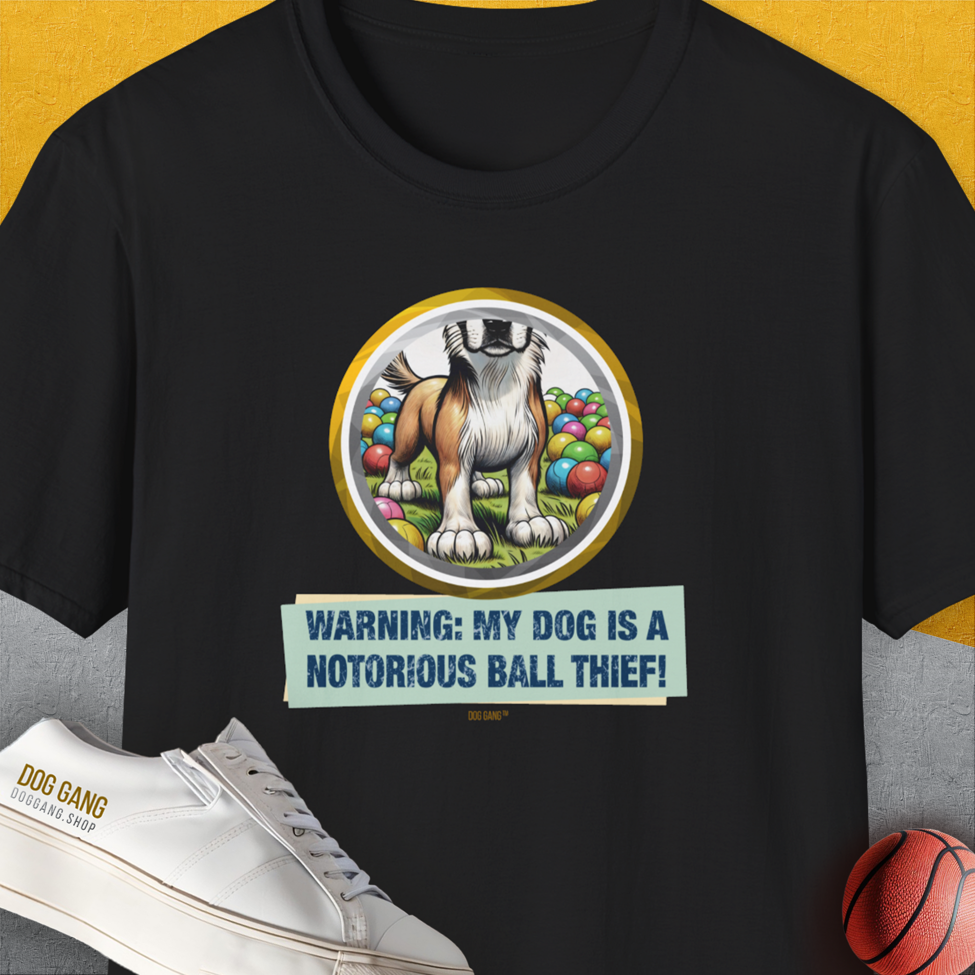 Unisex black T-shirt with dog graphic and the witty caption, Warning: My Dog Is A Notorious Ball Thief, Volume 2. Perfect for a funny dog shirt. Designed by Dog Gang.