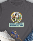 A charcoal womens tee with a cartoon dog guarding balls and text Warning: My Dog Is A Notorious Ball Thief, Volume 2, perfect for the dog lover. Designed by Dog Gang.
