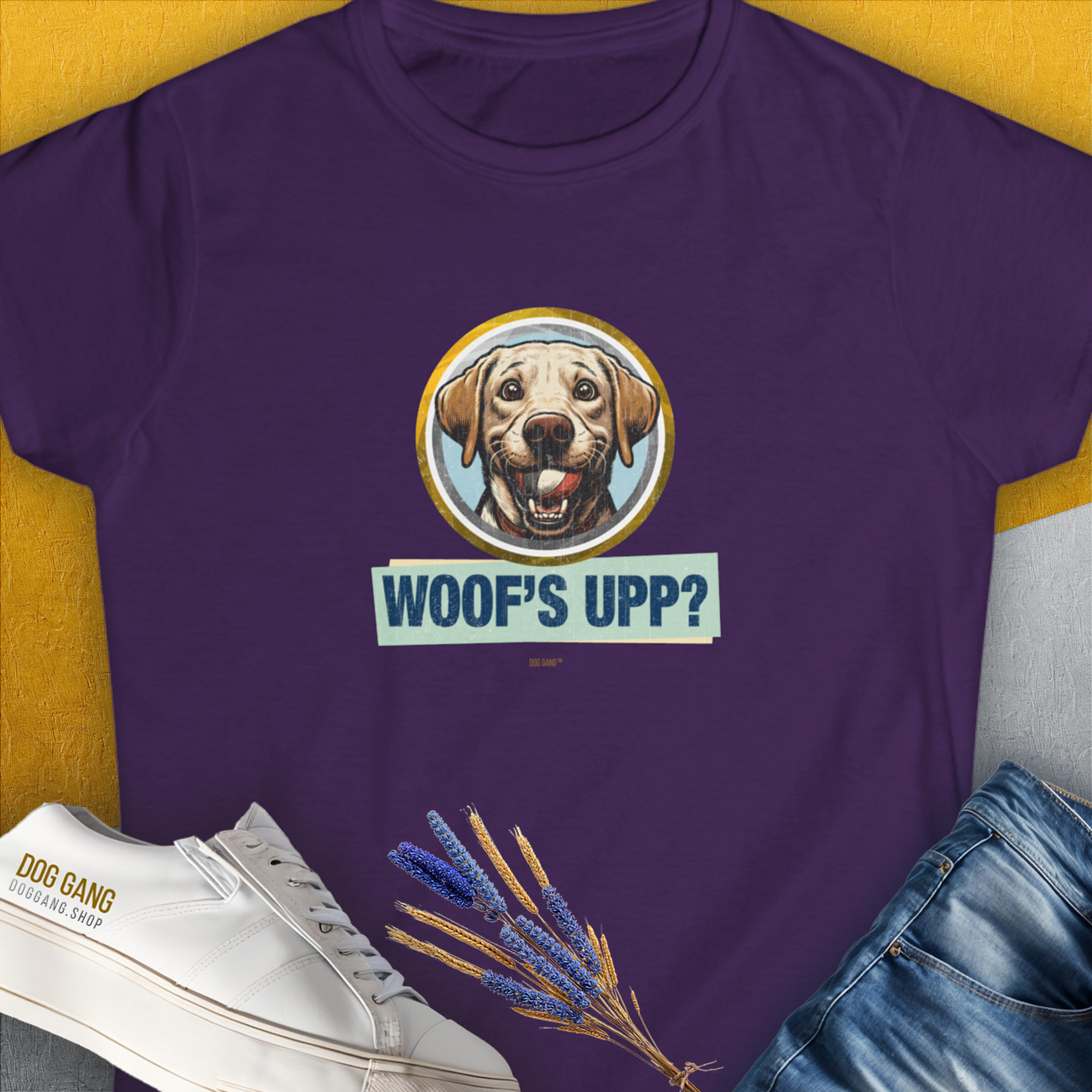 The Woofs Upp? Volume 3 womens t-shirt in purple showcases a funny dog print and is crafted from ringspun cotton. Designed by Dog Gang.